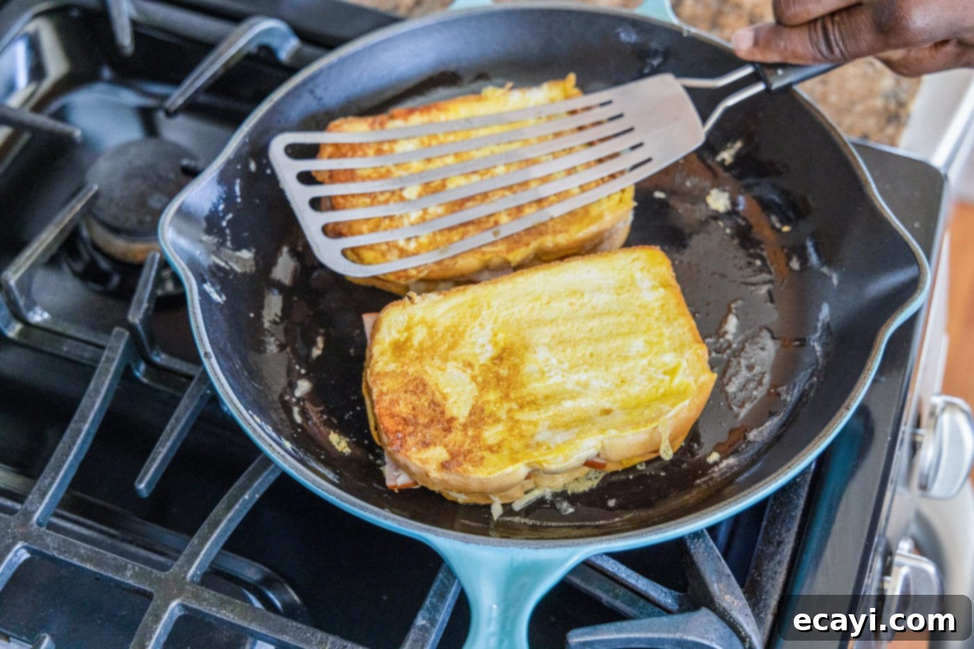 Sweet and Savory Monte Cristo Indulgence 13 frying a monte cristo sandwich in a skillet