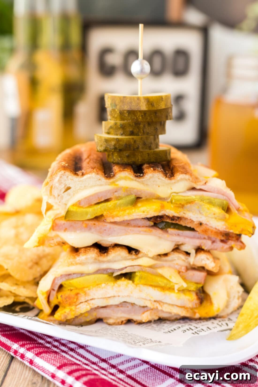 Cuban Sandwich: A Taste of Miami's Legacy 2 stacked Cuban Sandwich with layers of pork, ham, Swiss cheese, pickles, and mustard