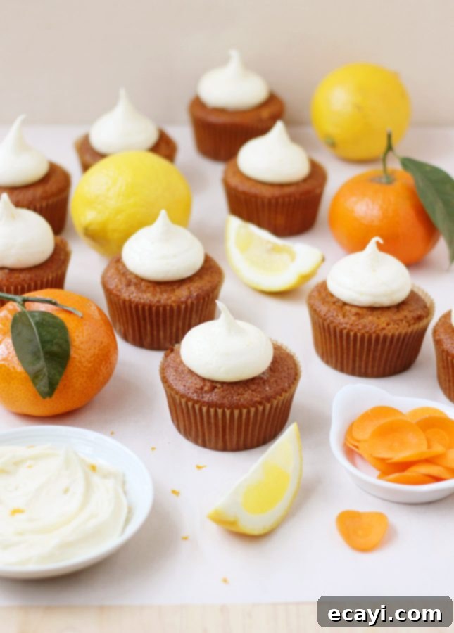 Sun-Kissed Orange Carrot Cupcakes with Tangy Cream Cheese Topping 2 Moist Orange and Carrot Cupcakes with Zesty Cream Cheese Frosting // FoodNouveau.com