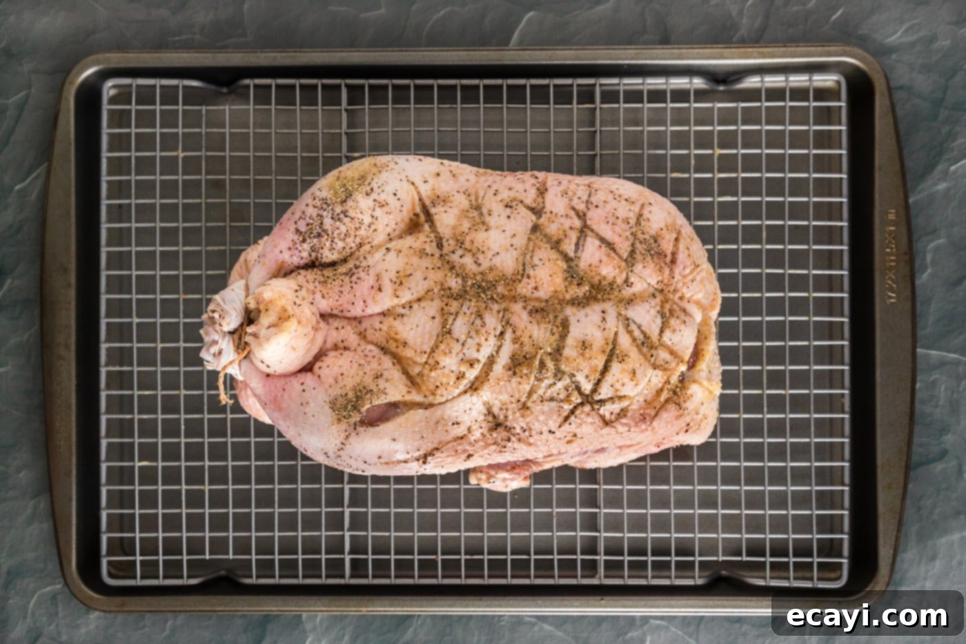 Crispy Roast Duck 6 scored whole duck on a baking sheet