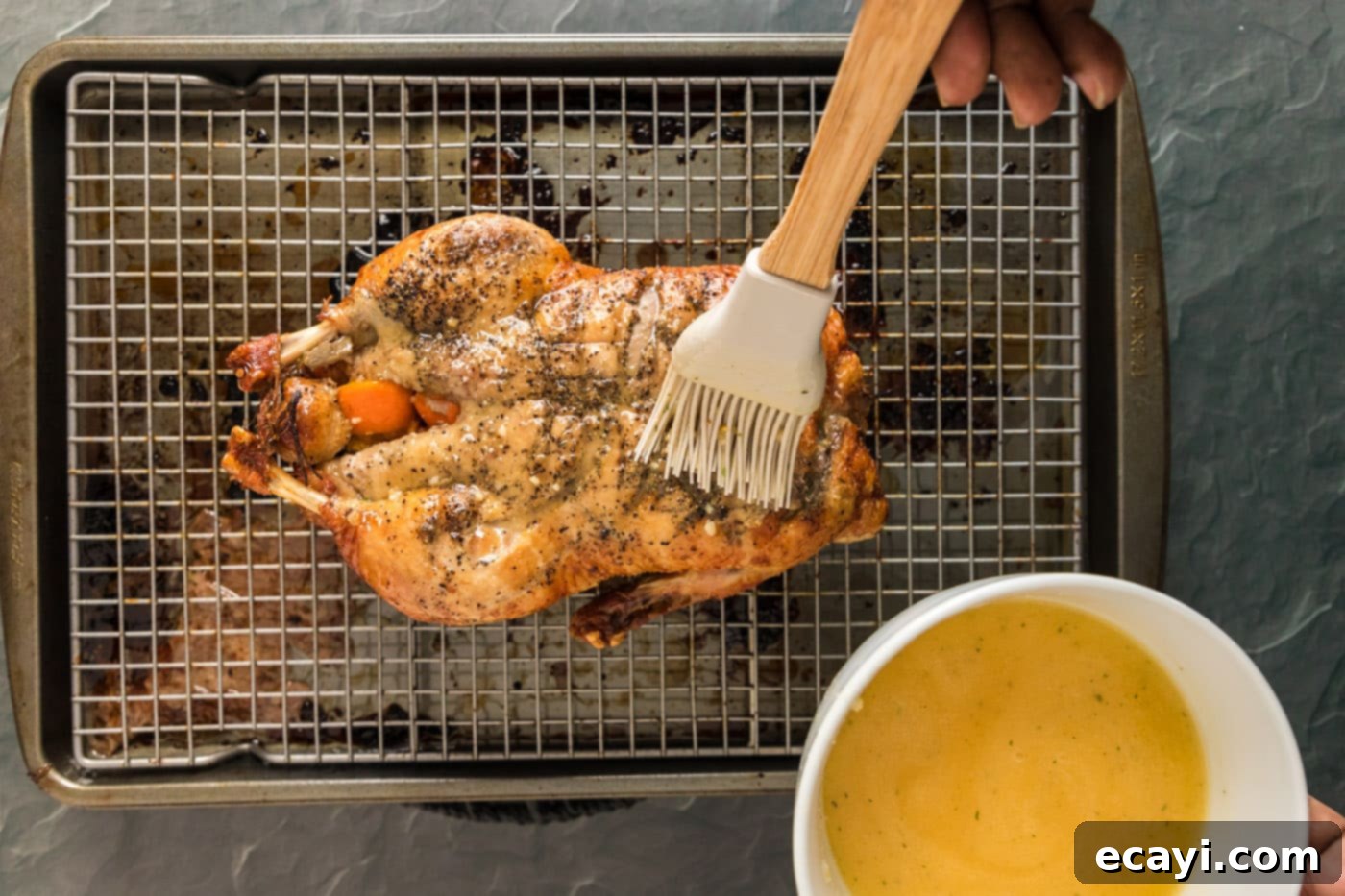 Crispy Roast Duck 9 bating whole duck with mandarin juice and butter