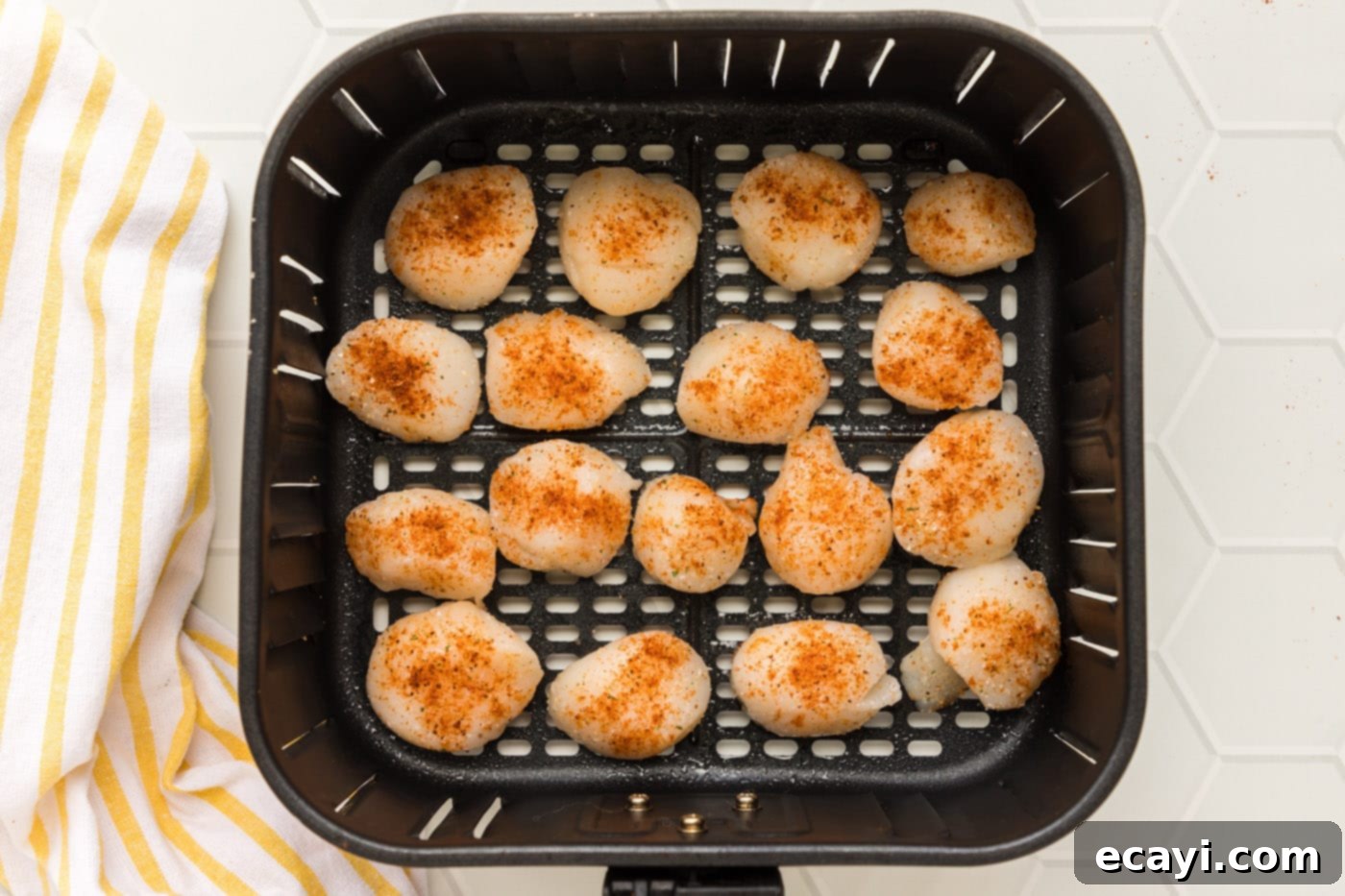 Perfect Air Fryer Scallops 7 scallops neatly arranged in the air fryer basket without crowding