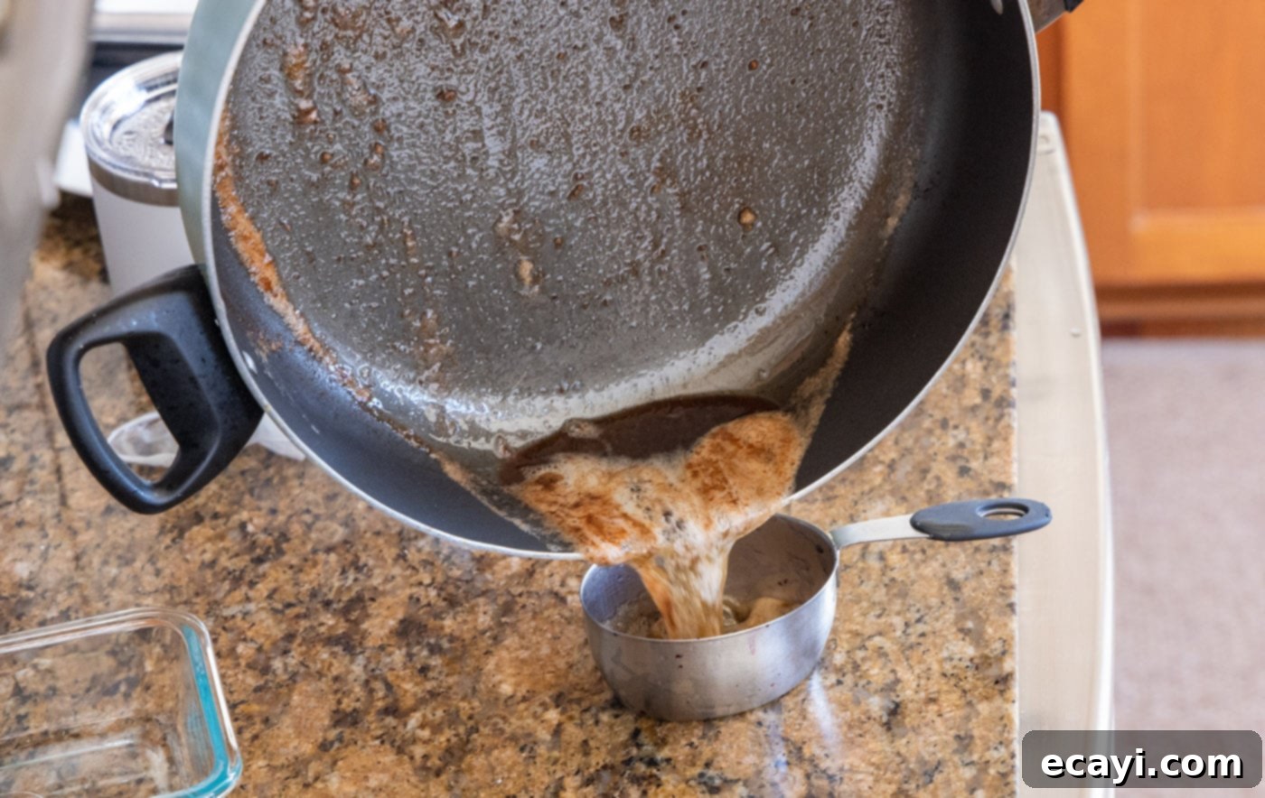 The Proposal Chicken 12 draining oil and butter mixture from chicken