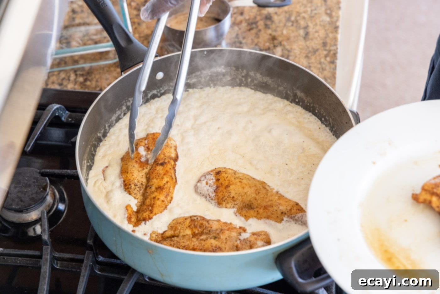 The Proposal Chicken 16 dredging chicken breasts in heavy cream mixture