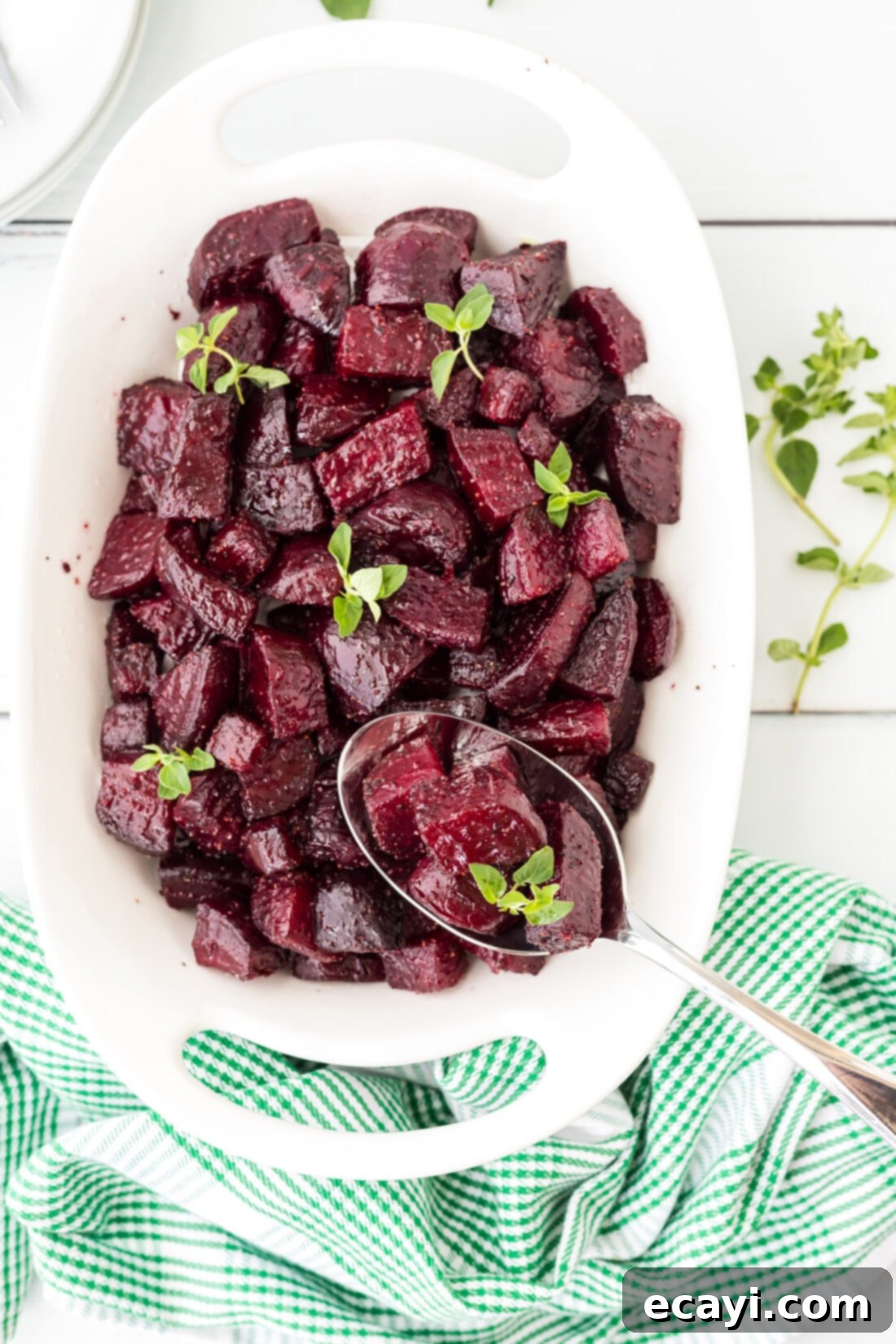 Caramelized Beet Perfection 2 Vibrant dish of freshly roasted beets, ready to serve, with a spoon for scooping