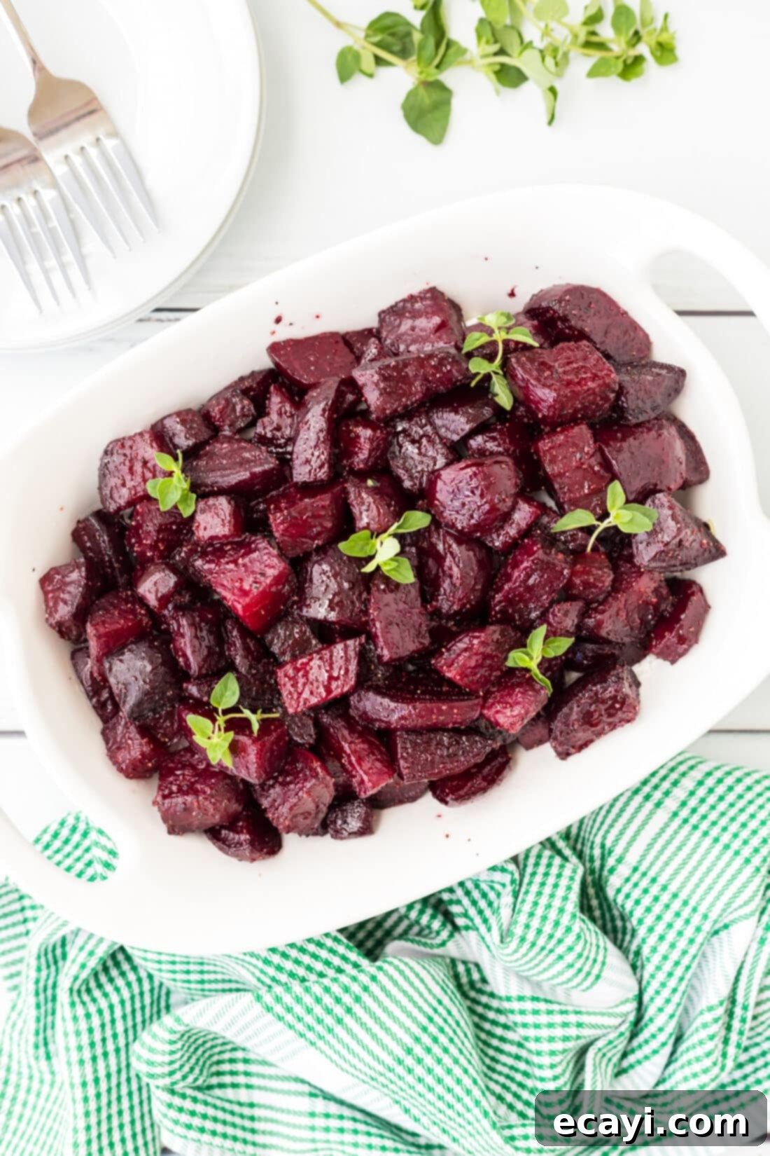 Caramelized Beet Perfection 3 Close-up of roasted beet chunks in a casserole dish, glistening with olive oil and seasoning