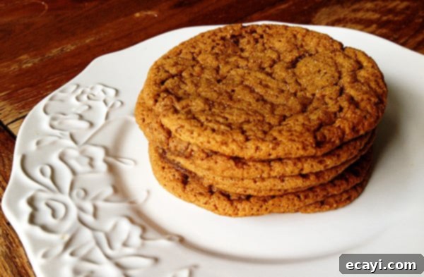 Sugar Topped Molasses Spice Cookies - AmandasCookin.com A close up photo of a stack of sugar topped molasses spice cookies