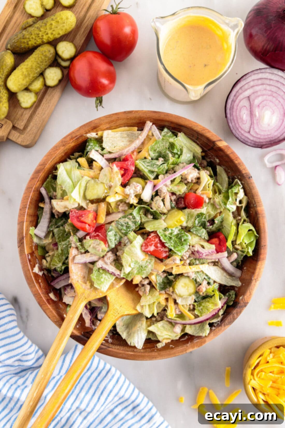 Deconstructed Big Mac Salad 3 Big Mac Salad with serving spoons, a vibrant and fresh low-carb meal