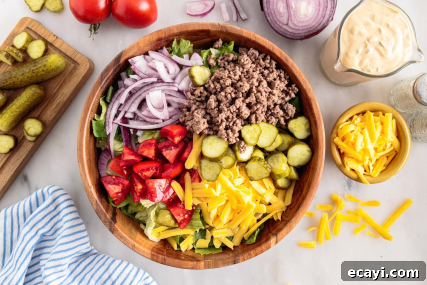 Deconstructed Big Mac Salad 8 Big Mac salad ingredients in a bowl, before dressing is added