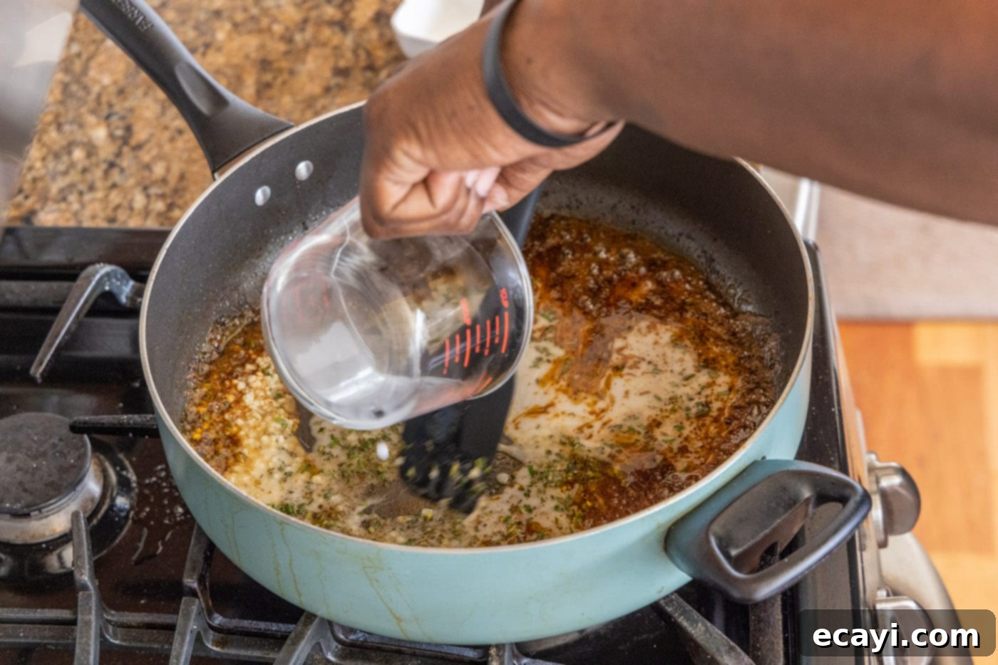 Succulent Veal Chops 11 Fresh lemon juice being poured into the skillet, creating a sizzling effect as it deglazes the pan and combines with the aromatics.