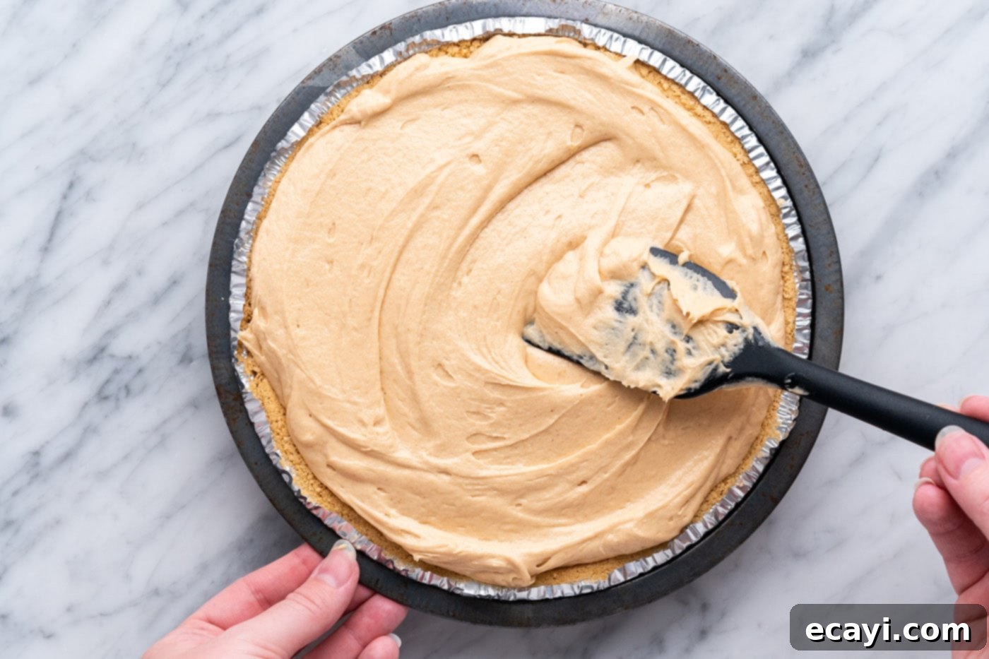 Peanut Butter Perfection Pie 11 smoothing Reese's pie with a spatula