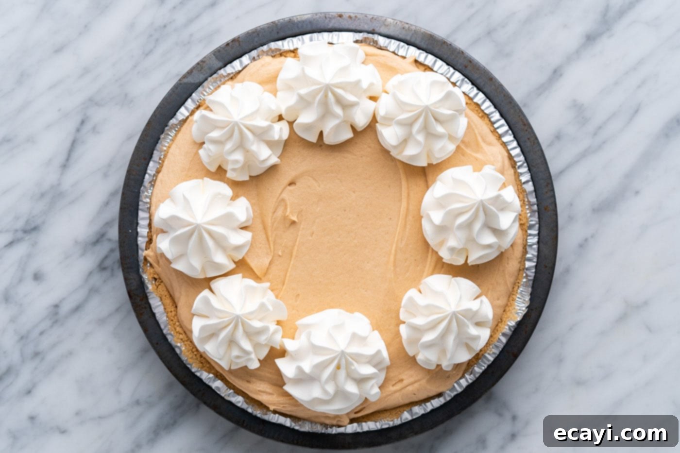 Peanut Butter Perfection Pie 12 piped whipped cream rosettes on top of Reeses pie