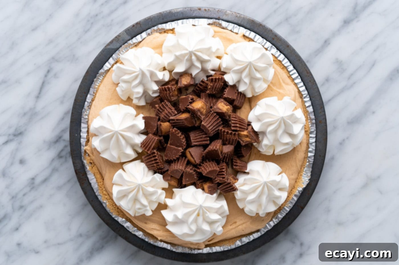 Peanut Butter Perfection Pie 13 chopped peanut butter cups in the center of Reese's pie