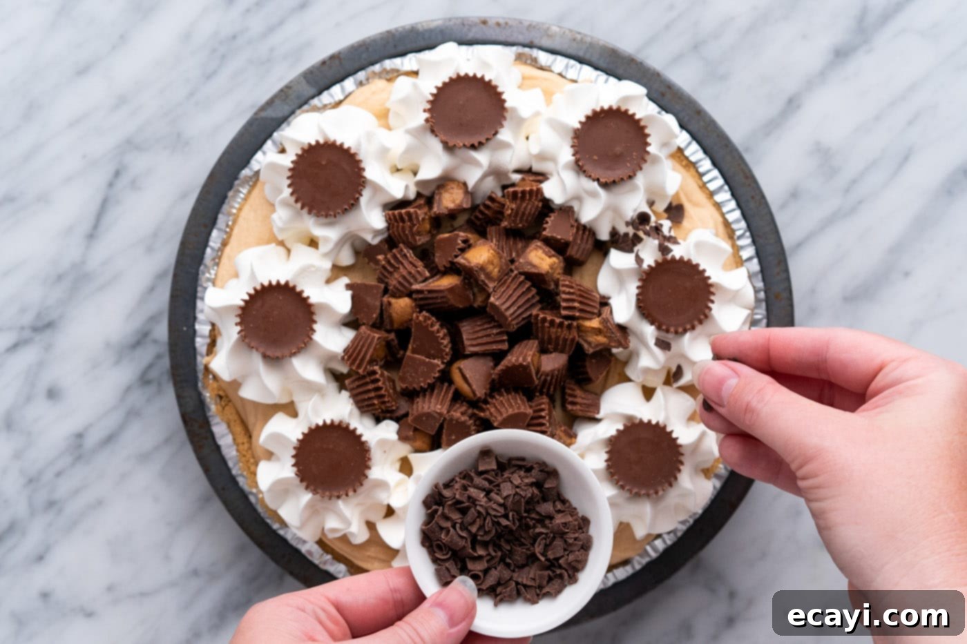 Peanut Butter Perfection Pie 15 sprinkling shaved chocolate on top of Reese's pie