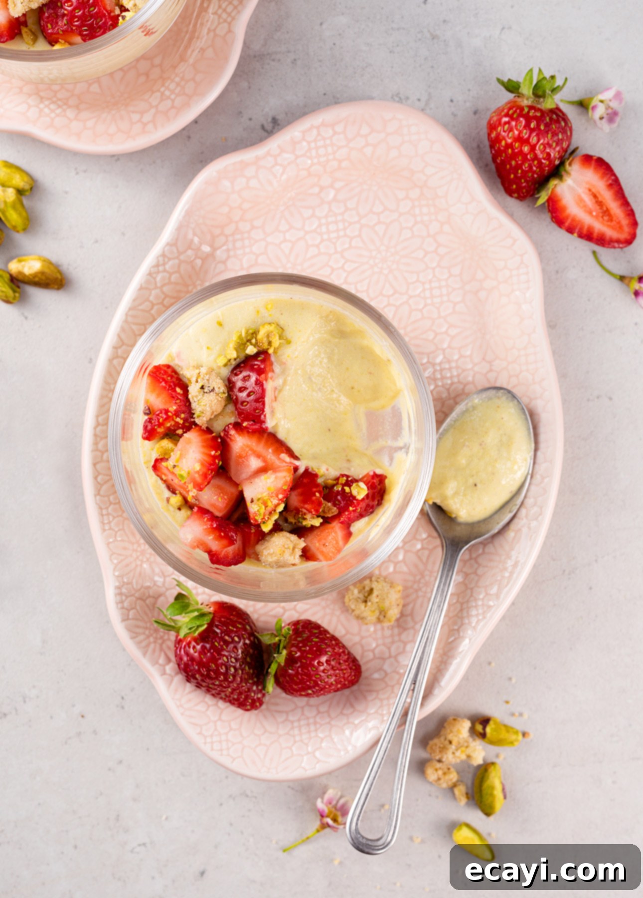 Strawberry Kissed Pistachio Delights 4 Pistachio Pudding desserts artfully arranged with fresh strawberries and crumble // FoodNouveau.com