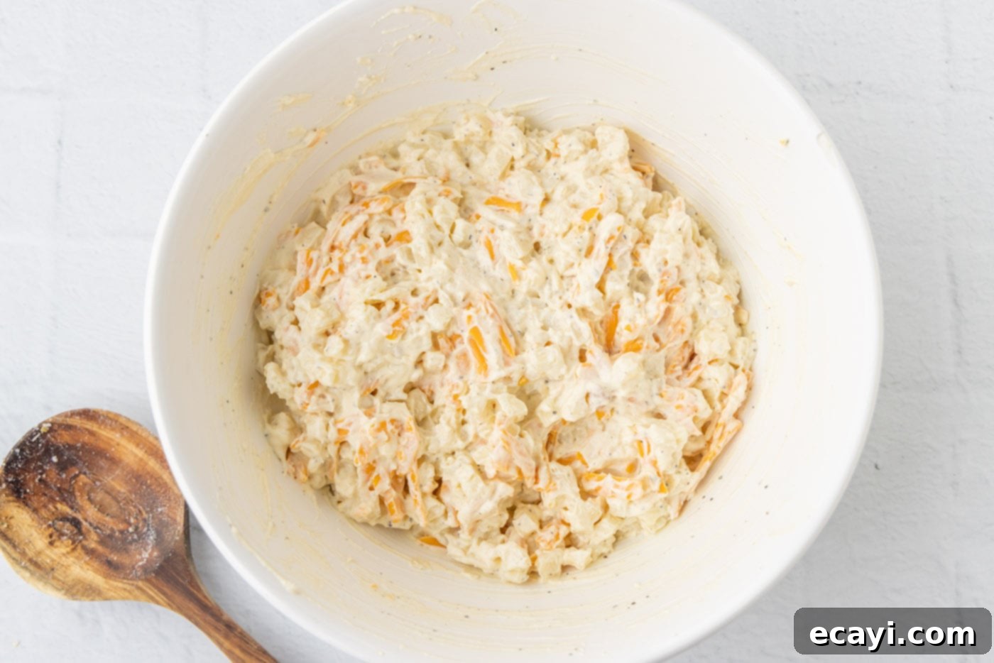 Heartwarming Potato Casserole 11 funeral potato mixture thoroughly combined in a bowl