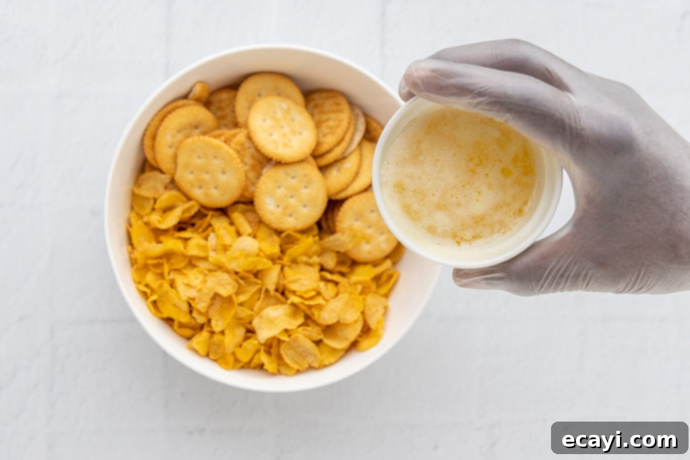 Heartwarming Potato Casserole 12 ritz crackers and cornflakes in a bowl with melted butter for topping