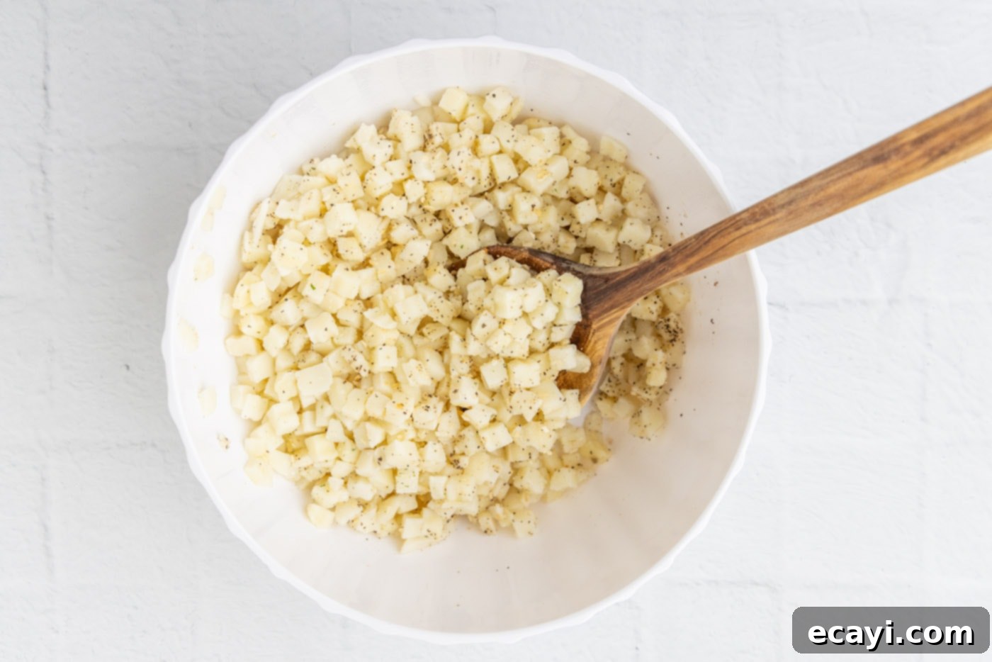 Heartwarming Potato Casserole 7 funeral potatoes mixture in a bowl