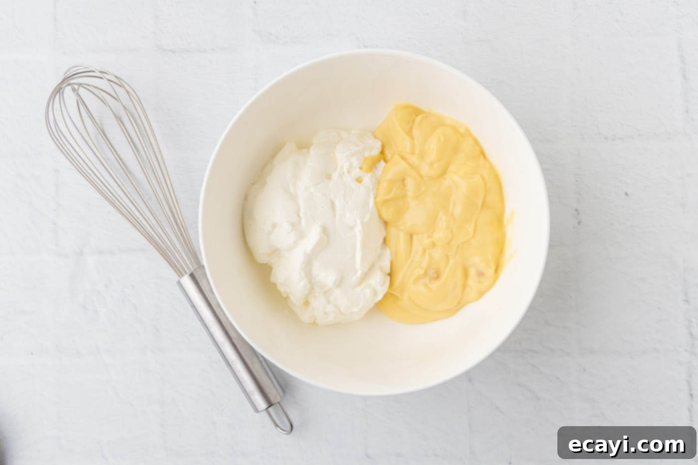 Heartwarming Potato Casserole 8 cream of chicken soup and sour cream in a bowl for funeral potatoes