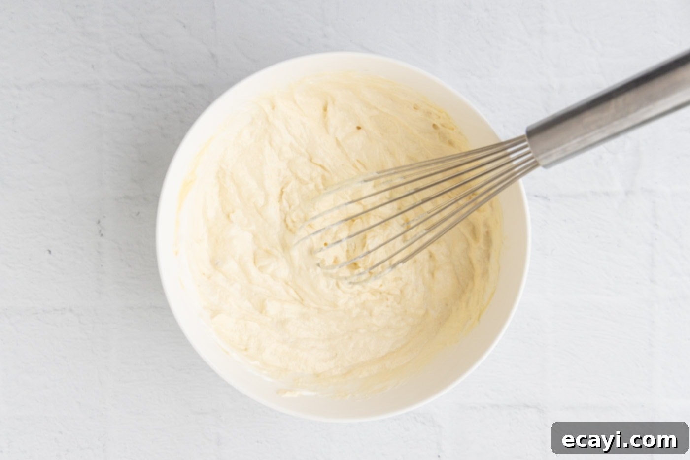 Heartwarming Potato Casserole 9 whisked cream of chicken soup and sour cream mixture