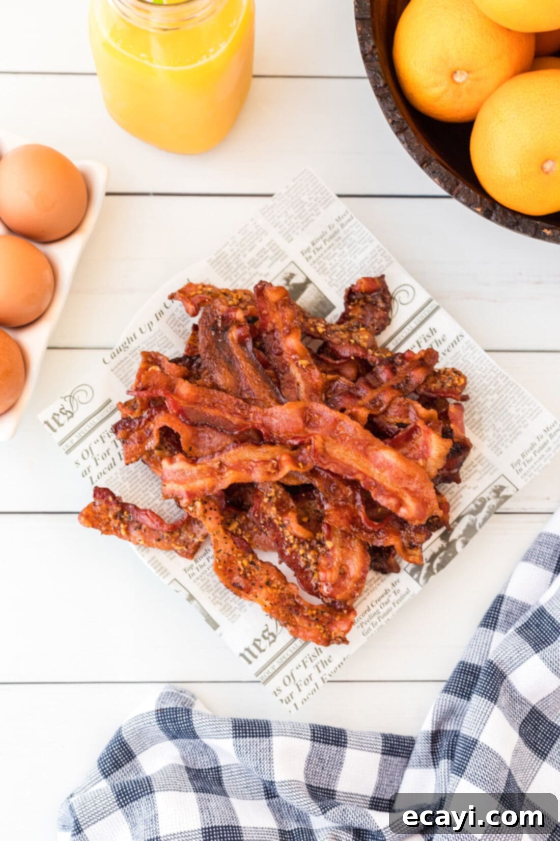 Perfect Crispy Oven Bacon 3 A plate filled with golden, crispy bacon slices cooked to perfection in the oven