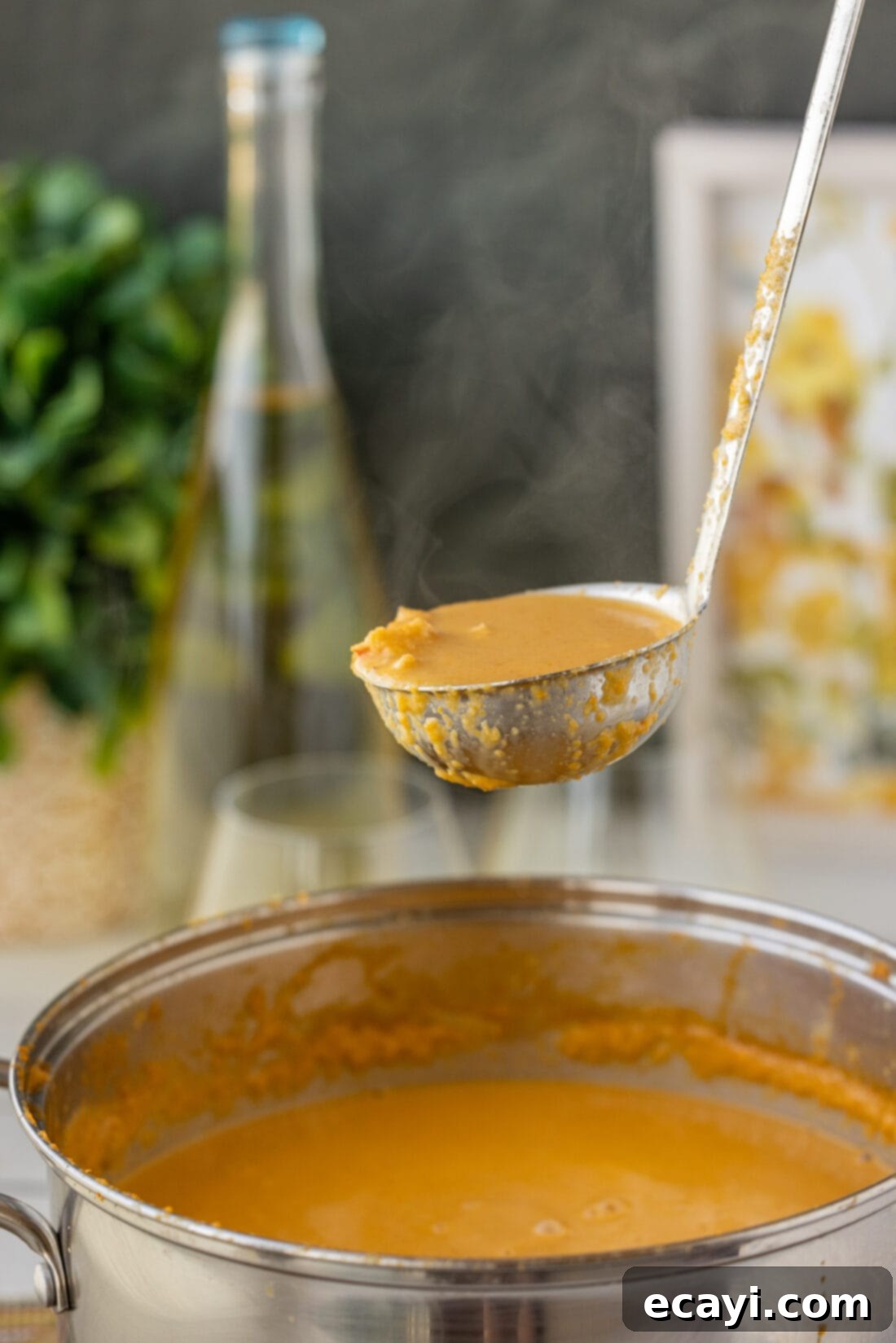 Rich Lobster Bisque 2 A ladle lifting a spoonful of creamy lobster bisque, showcasing its rich texture and chunks of lobster