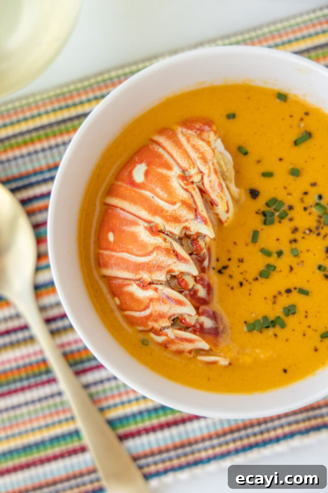 Rich Lobster Bisque 3 A bowl of rich, creamy lobster bisque garnished with fresh parsley