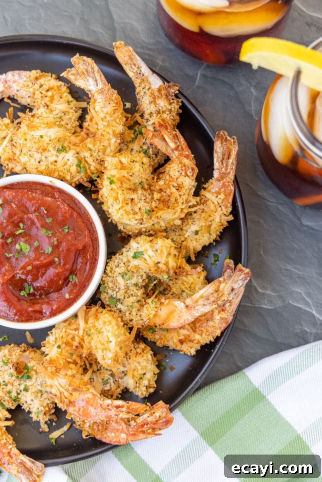 Crispy Air Fryer Coconut Shrimp 2 Air Fryer Coconut Shrimp on plate with sauce