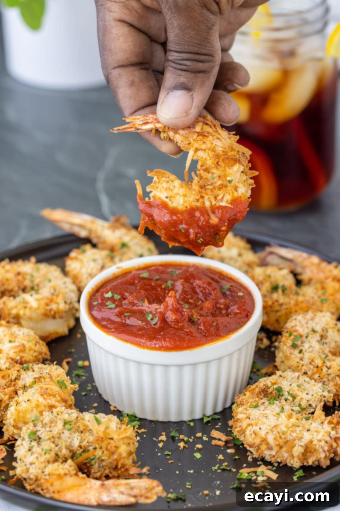 Crispy Air Fryer Coconut Shrimp 13 dipping Air Fryer Coconut Shrimp in cocktail sauce