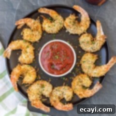 Crispy Air Fryer Coconut Shrimp 14 Air Fryer Coconut Shrimp on black plate