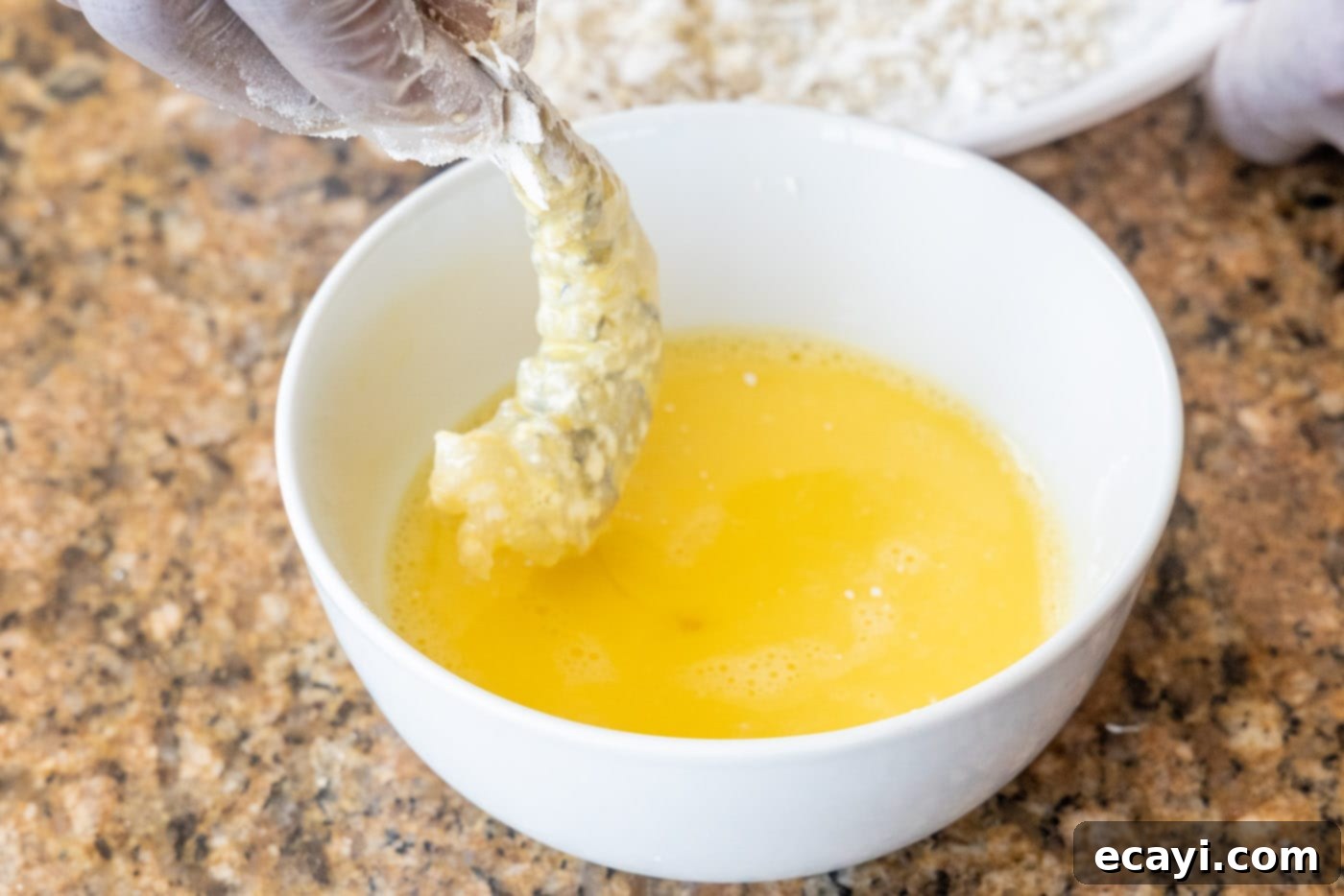 Crispy Air Fryer Coconut Shrimp 7 dipping flour dredged shrimp in egg