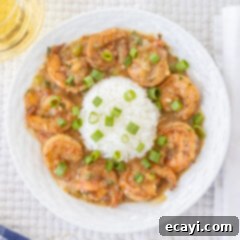 Authentic Cajun Shrimp Etouffee 14 A beautifully presented bowl of Shrimp Etouffee with a side of rice, ready to be enjoyed.