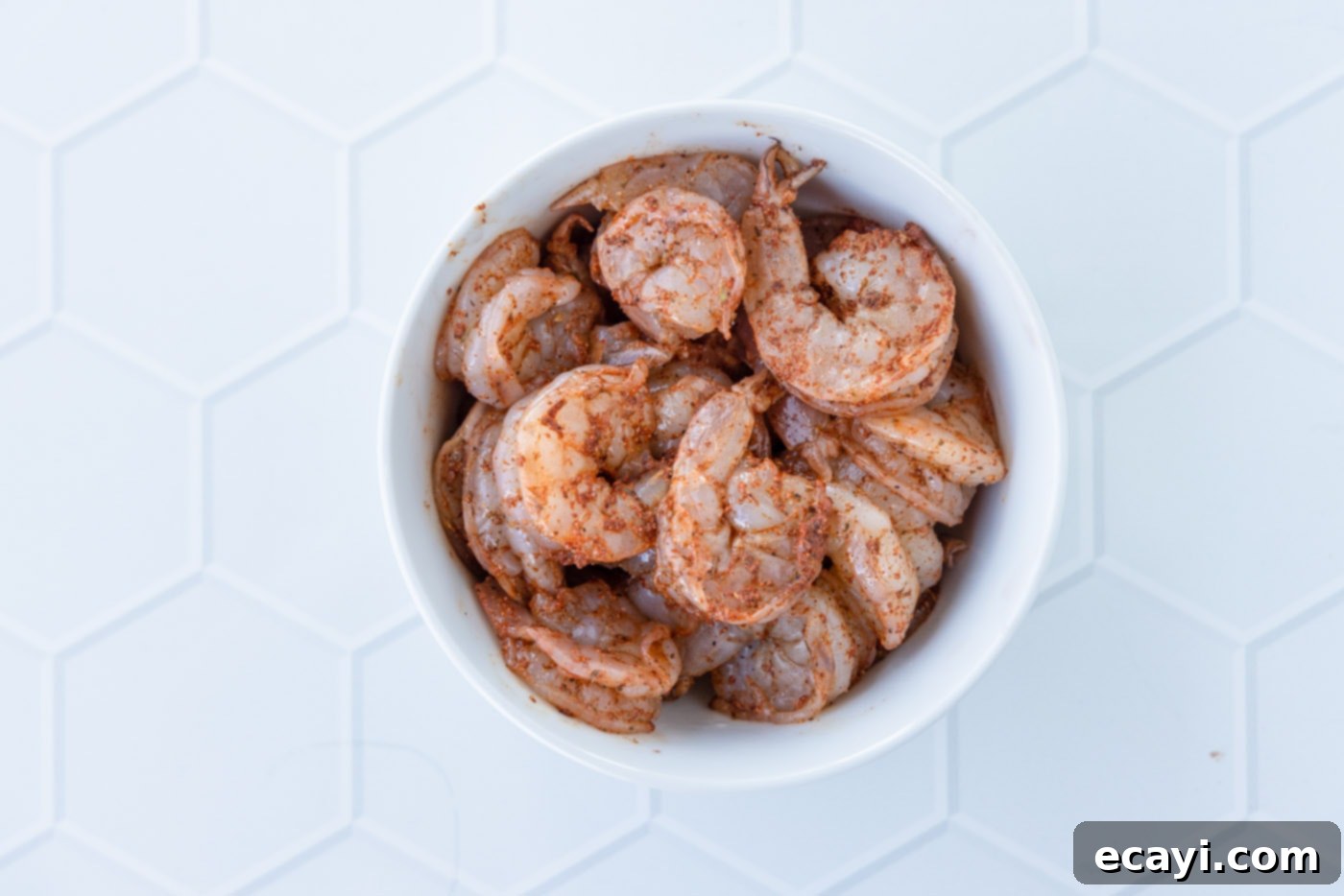 Authentic Cajun Shrimp Etouffee 5 Raw shrimp generously coated with vibrant Cajun seasoning.