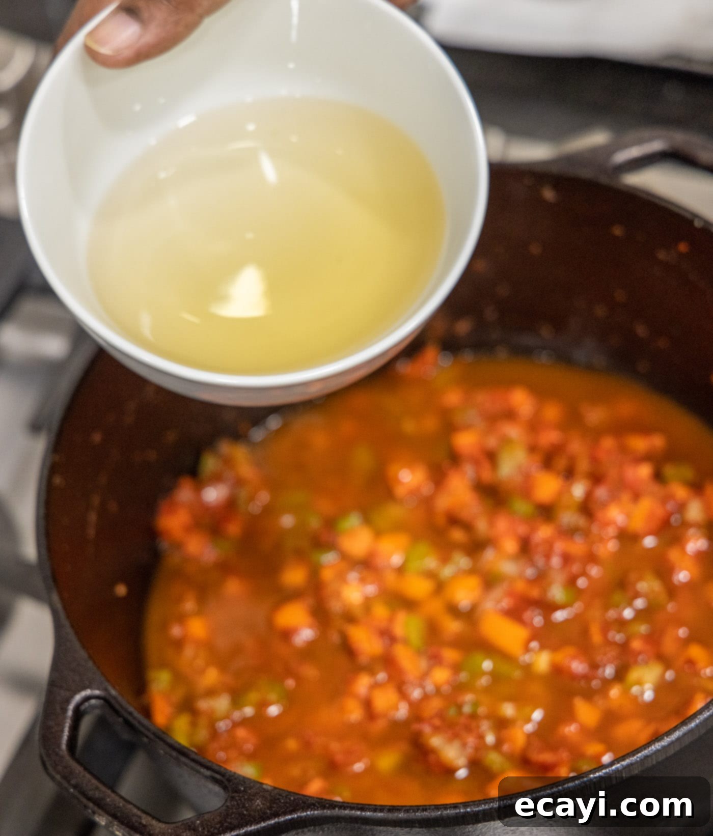 Exquisite Veal Osso Buco 12 adding white wine to the veal osso buco in a dutch oven