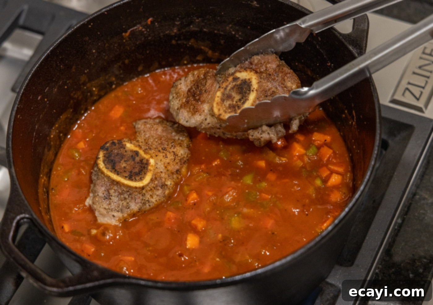 Exquisite Veal Osso Buco 14 adding veal shanks back to the osso buco in the dutch oven
