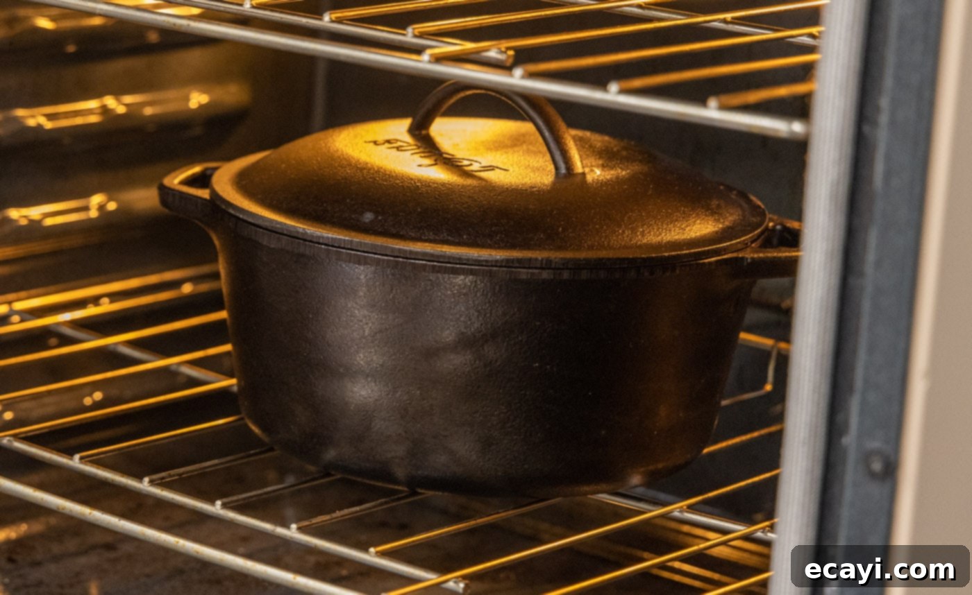 Exquisite Veal Osso Buco 15 dutch oven containing veal osso buco baking in the oven