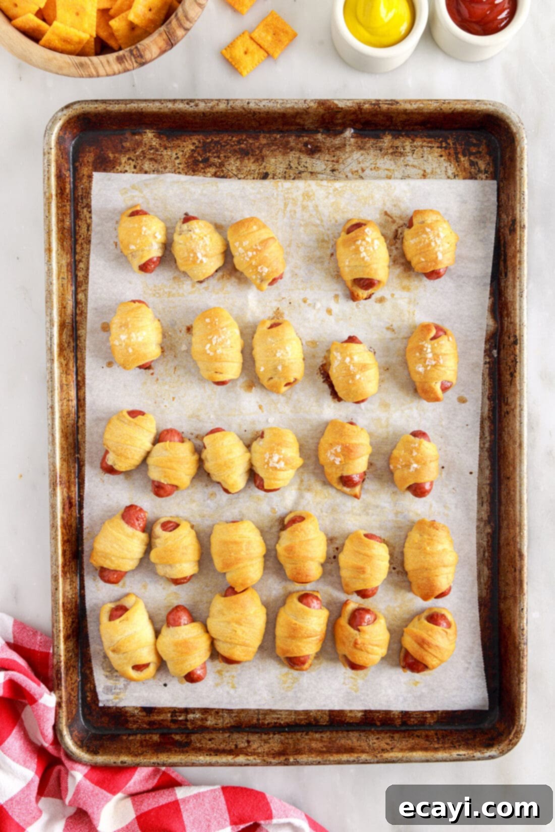 Swaddled Sausages 11 baking pan full of freshly baked Pigs in a Blanket