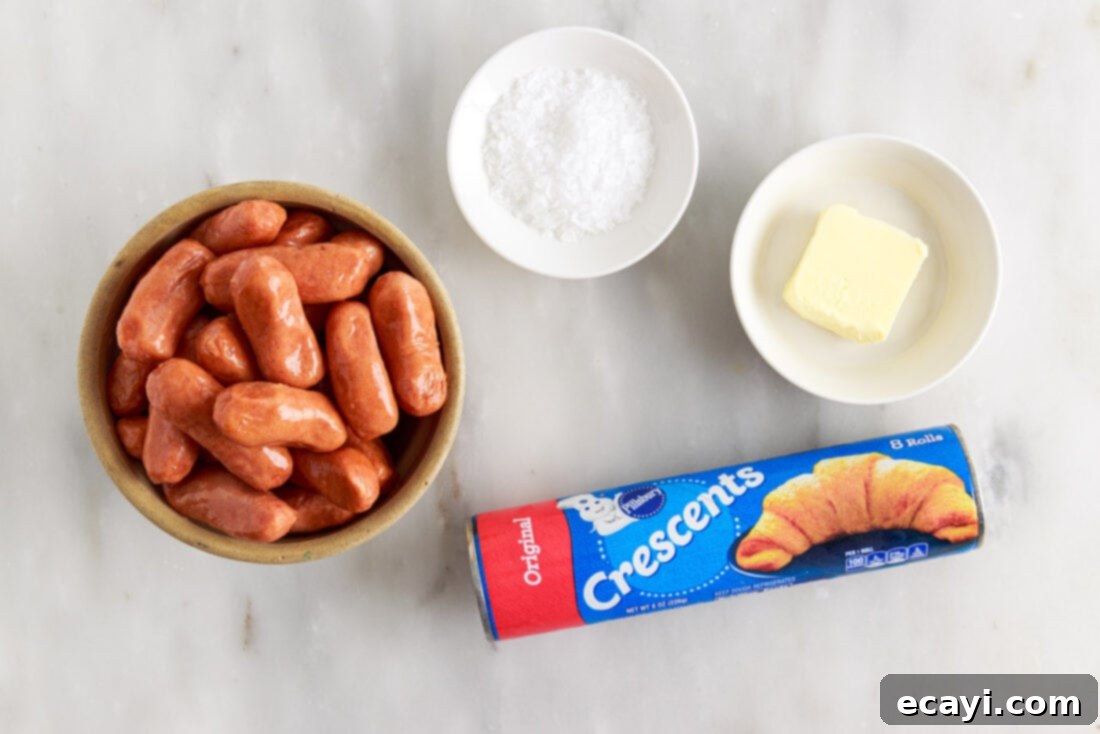 Swaddled Sausages 4 Ingredients for making Pigs in a Blanket: crescent rolls, mini sausages, butter, and sea salt