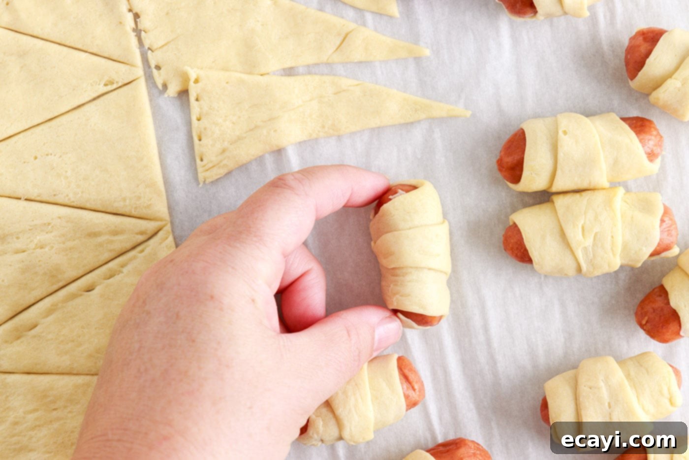 Swaddled Sausages 8 prepared mini crescent dogs arranged on a baking sheet