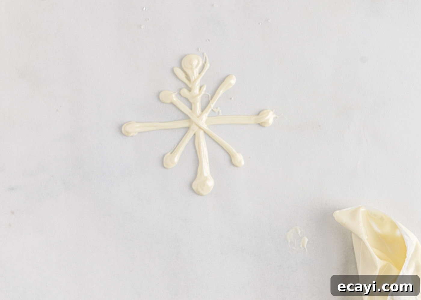 Crystalline Dream Cake 12 Detailed process of how to make white chocolate snowflakes, showing multiple lines for sturdiness.