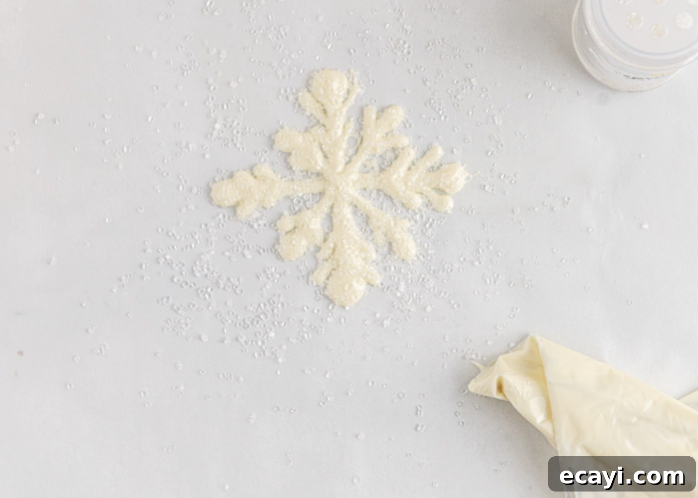 Crystalline Dream Cake 14 Finished piped white chocolate snowflakes sprinkled with sugar crystals.