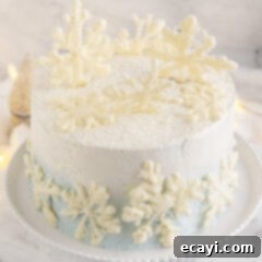 Crystalline Dream Cake 25 Snowflake Cake on a cakeplate, showcasing the ombre frosting and white chocolate snowflakes.