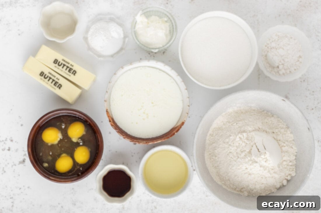 Crystalline Dream Cake 4 A selection of dry ingredients and liquids for the Snowflake Cake, including flour, sugar, eggs, and buttermilk.