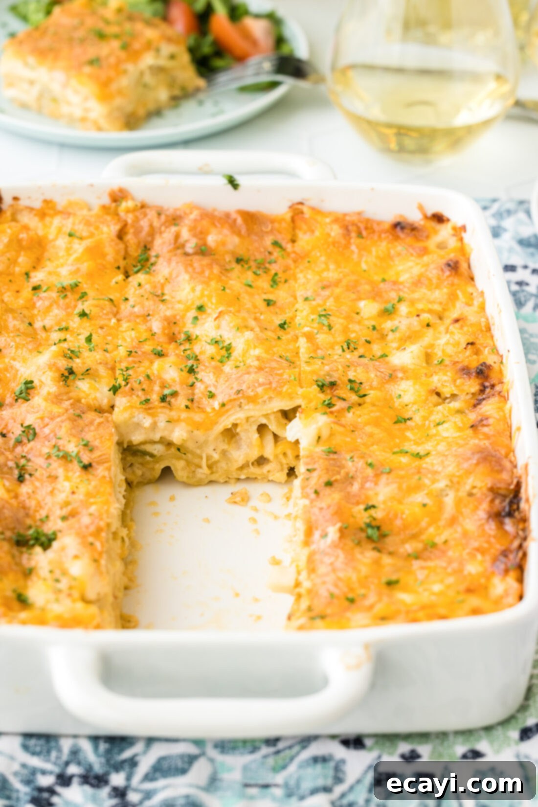 Ocean's Bounty Lasagna 3 A baking pan filled with freshly baked creamy seafood lasagna, golden brown and bubbling, ready to be served.