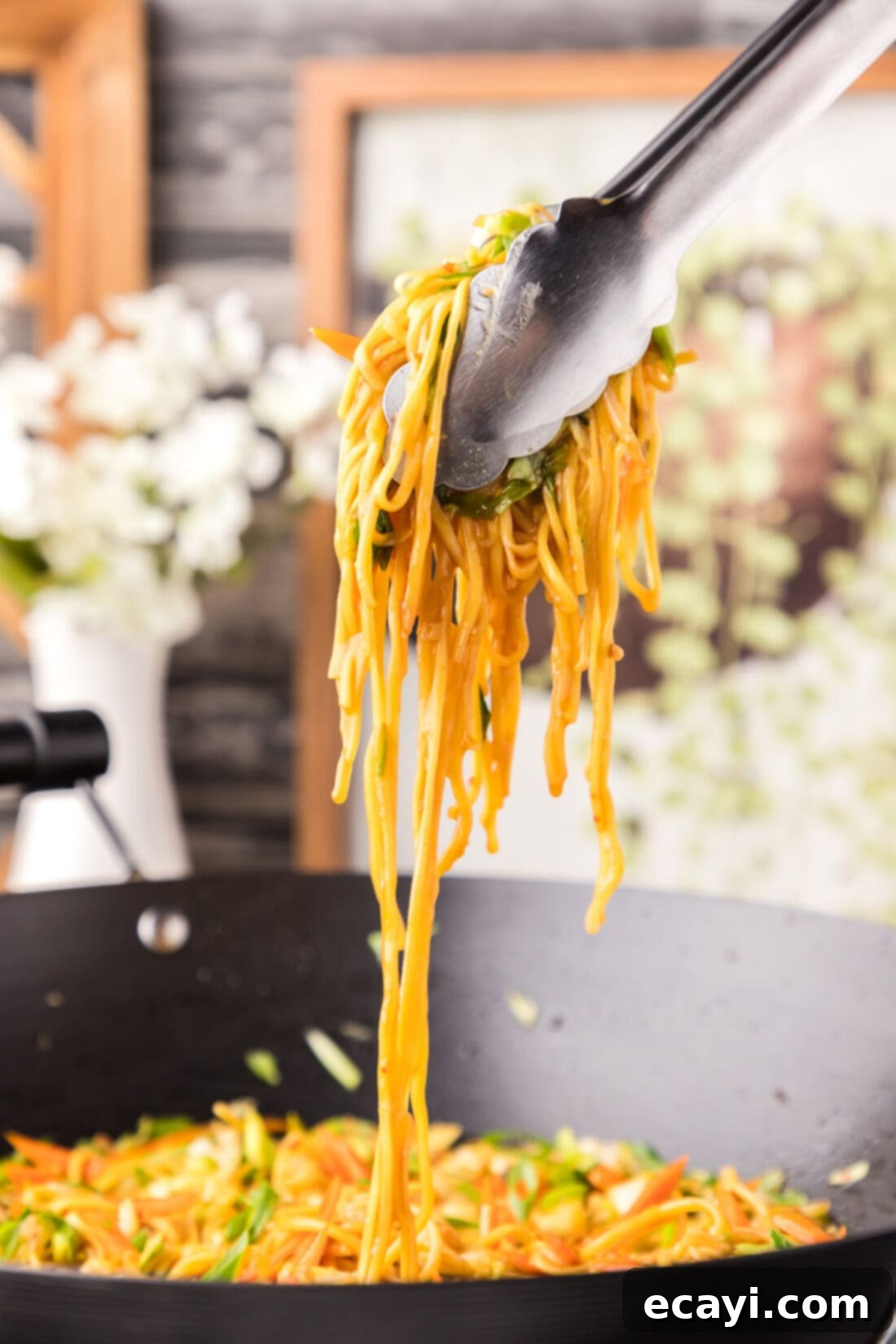 Chow Mein 2 lifting Chow Mein with tongs
