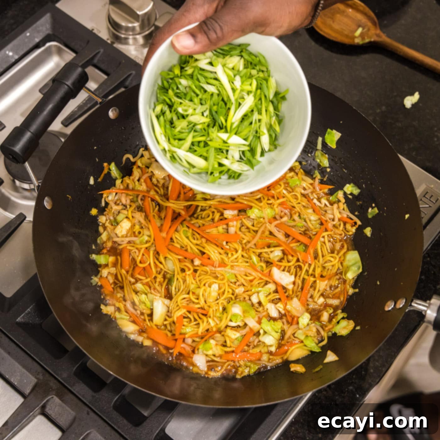 Chow Mein 12 adding green onions to skillet of chow mein