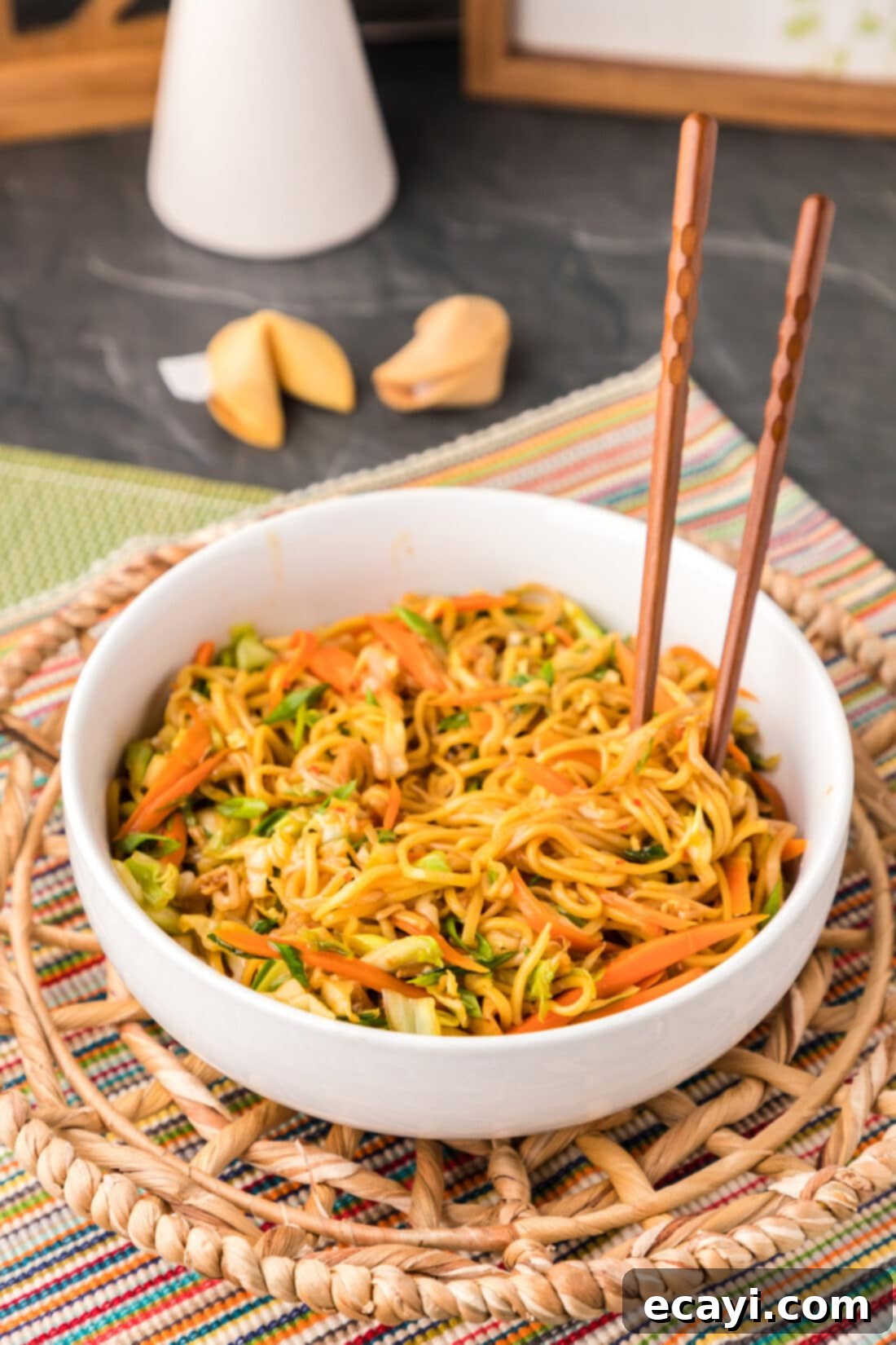 Chow Mein 3 chopsticks standing in bowl of Chow Mein