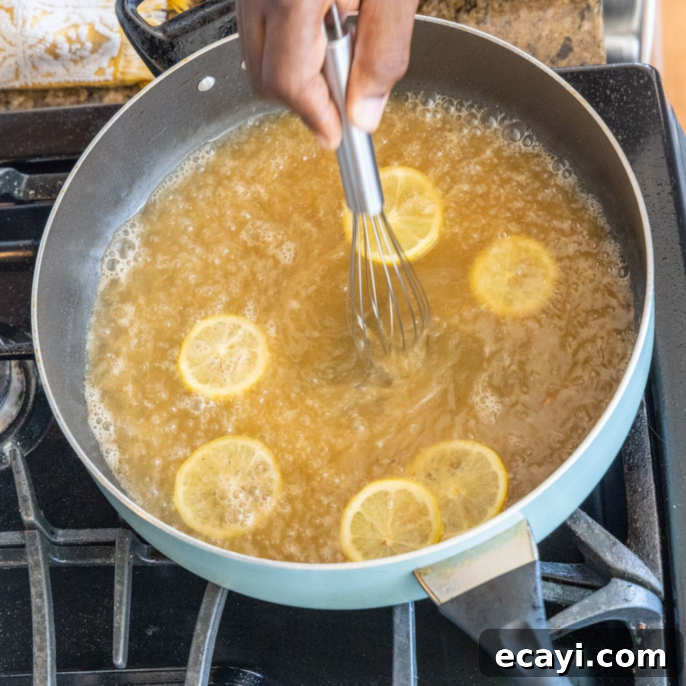 Golden Lemon Chicken 15 whisking lemon juice with white wine in a skillet