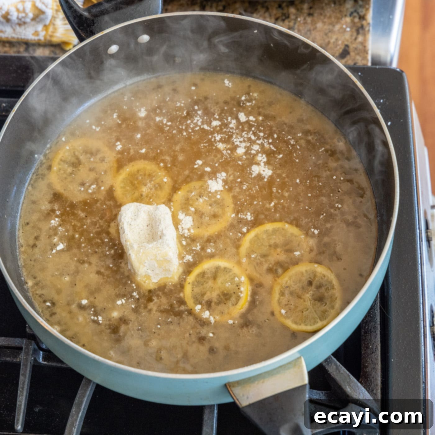 Golden Lemon Chicken 17 butter coated in flour added to skillet with lemon slices and white wine