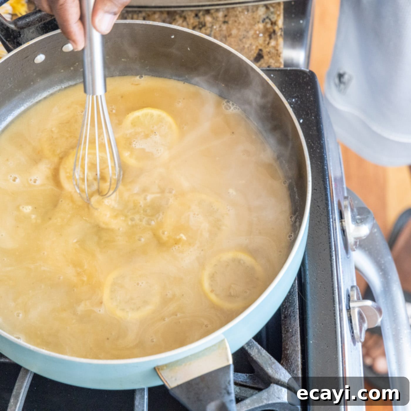 Golden Lemon Chicken 18 whisking butter and flour pan sauce with lemon